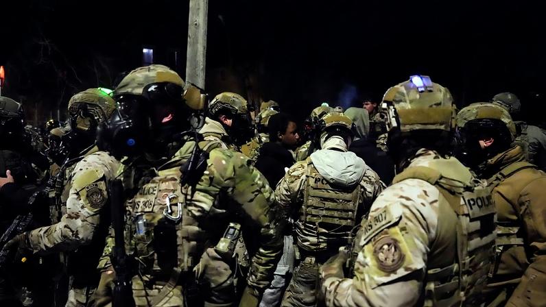 Members of law enforcement gather, as tensions rise after federal law enforcement agents were involved in a shooting incident, a week after a U.S. Immigration and Customs Enforcement (ICE) agent fatally shot Renee Nicole Good, in Minneapolis, Minnesota, U.S., January 14, 2026. REUTERS/Leah Millis