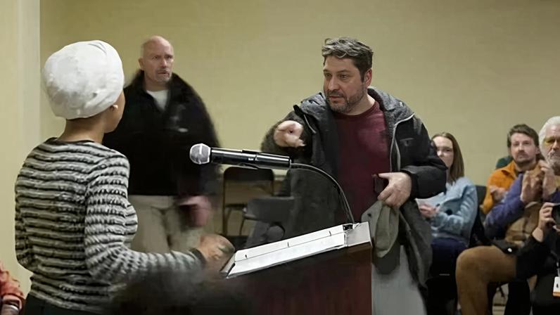 A man shouts at U.S. Rep. Ilhan Omar after spraying her, during a town hall meeting in MinneapolisA man shouts at U.S. Representative Ilhan Omar (D-MN) after spraying an unidentified liquid in her direction, during a town hall meeting days after a man identified as Alex Pretti was fatally shot by federal immigration agents trying to detain him, in Minneapolis, Minnesota, U.S., January 27, 2026 in a still image from video. REUTERS/Maria Alejandra Cardona TPX IMAGES OF THE DAY
