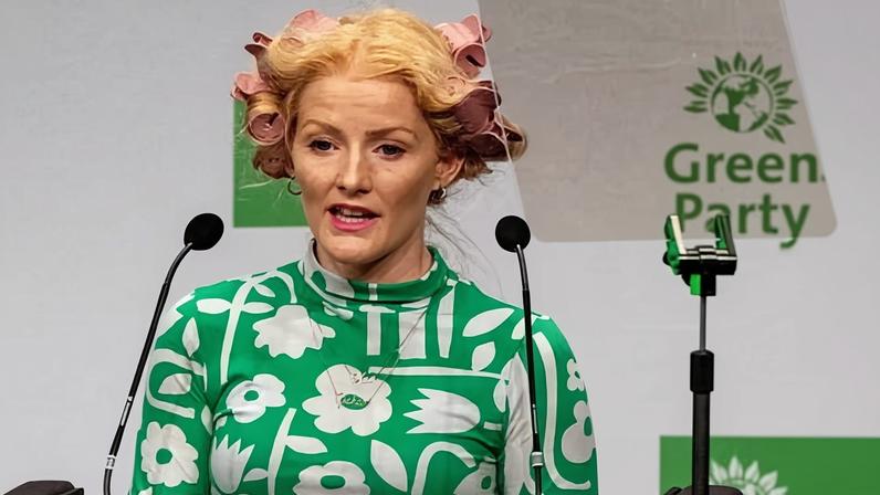 Hannah Spencer practicing her 2024 Green party conference speech with her hair curlers still in.