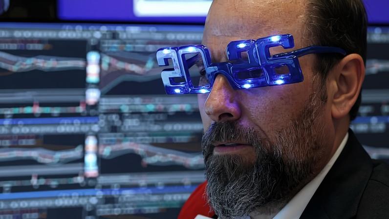 A trader on the New York Stock Exchange wears 2026 glasses to see in the new year.