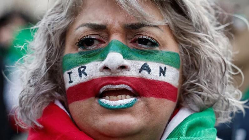 A demonstrator attends a rally in support of the Iranian people amid anti-government protests raging across Iran