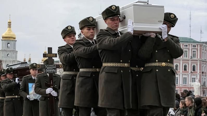 Ukrainian service members carry coffins during a funeral ceremony in Kyiv in November.