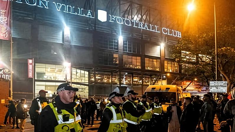A cordon of police officers form a barrier between pro-Israeli and pro-Palestinian groups outside Villa Park stadium in Birmingham last November.