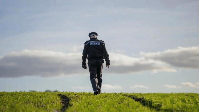 Insp Andy Lemon, the tactical lead for rural crime in Wiltshire, examines damage to farmland in the Vale of Pewsey.