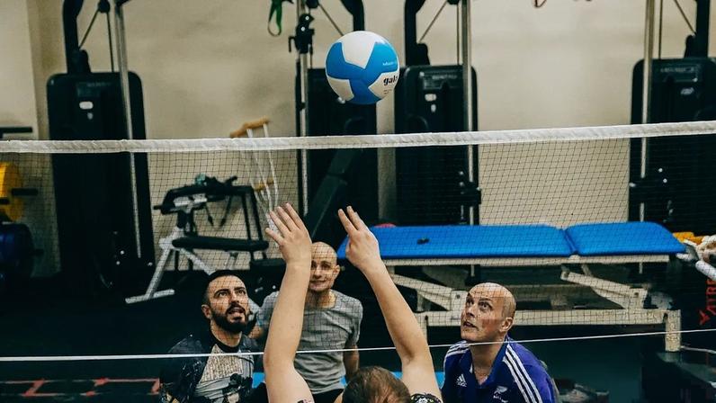 Veterans playing volleyball at the rehabilitation centre, a group activity that can help the wounded motivate each other. Photograph: Julia Kochetova/The Guardian