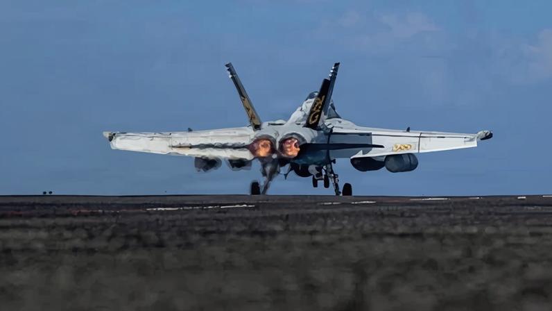 A US navy warplane on the flight deck of the aircraft carrier USS Abraham Lincoln in the Indian Ocean.