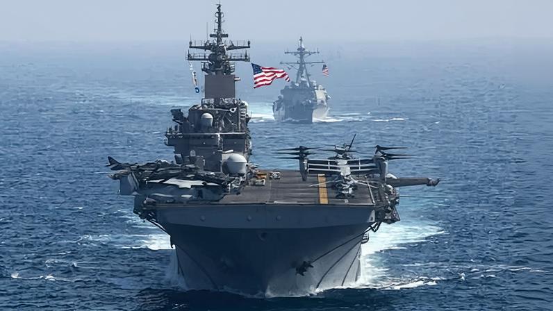 The aircraft carrier USS Abraham Lincoln flying a US flag