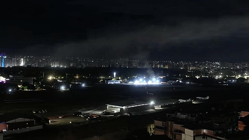Smoke rises at La Carlota airport after explosions and low-flying aircraft were reported in Caracas, Venezuela