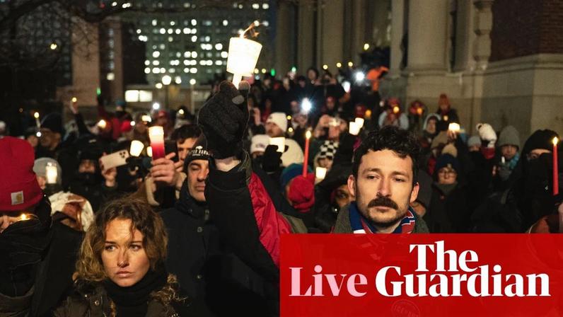 Nurses hold up their candles during a vigil for Alex Pretti in New York