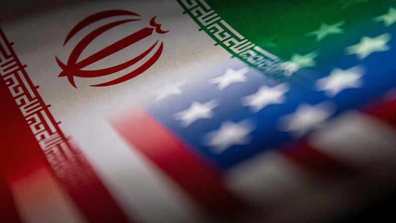 Iran's and U.S.' flags are seen printed on paper in this illustration taken January 27, 2022. REUTERS/Dado Ruvic/Illustration