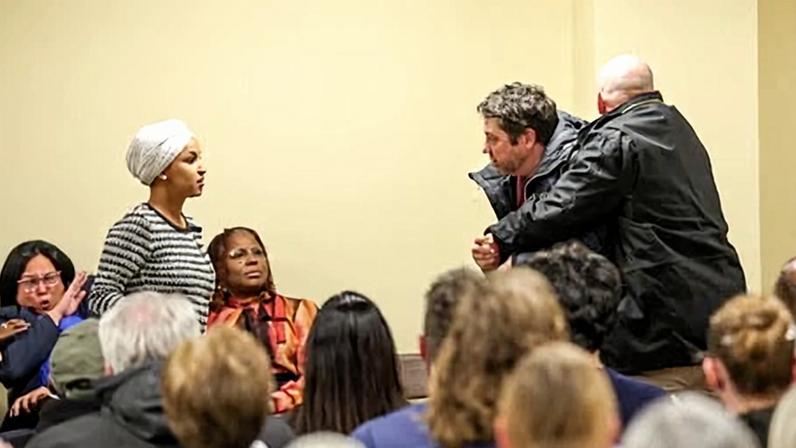 A man detained by security is accused of charging Ilhan Omar, a Democratic representative of Minnesota, and spraying her with an unknown substance during a town hall event in Minneapolis on 27 January 2026.
