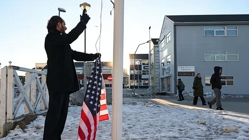 Maxi Schafroth attaching a US flag to a flagpole