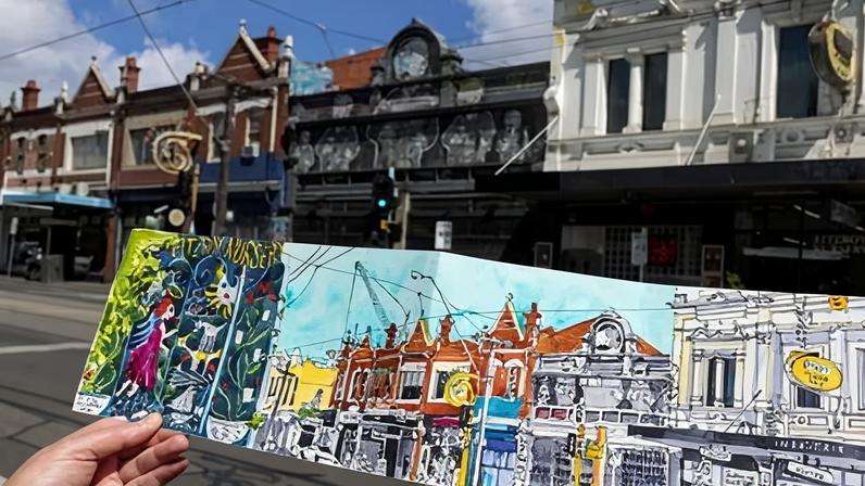 Helen Wilding holds one of her drawings of Brunswick Street, completed during the Covid-19 pandemic.