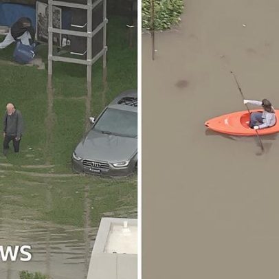 Moradores navegam de caiaque por águas de enchente na Baía de São Francisco