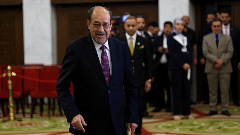 Former Iraqi Prime Minister Nouri al-Maliki walks at a polling station inside Al-Rasheed Hotel during the parliamentary election in Baghdad, Iraq, November 11, 2025. REUTERS/Thaier Al-Sudani/File Photo