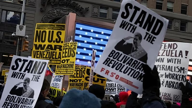 Protesters gathered in Times Square to join a rally organized by The People's Forum against the US military operation in Venezuela.