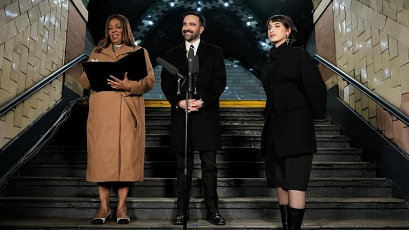 The New York attorney general, Letitia James, left, prepares to administer the oath of office to the mayor-elect, Zohran Mamdani, as his wife, Rama Duwaji, looks on.