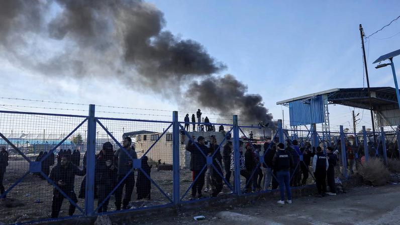 Detainees gather at al-Hol camp after the Syrian government took control of it, in Hasaka