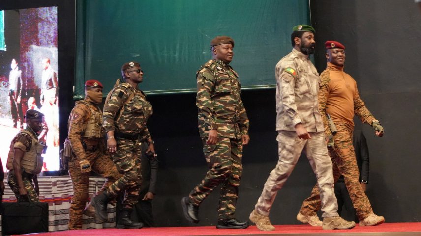 Heads of state of Mali's Assimi Goita, Burkina Faso's Captain Ibrahim Traore and Niger's General Abdourahamane Tiani walk together during the first ordinary summit of heads of state and governments of the Alliance of Sahel States (AES) in Niamey, Niger July 6, 2024. REUTERS/Mahamadou Hamidou