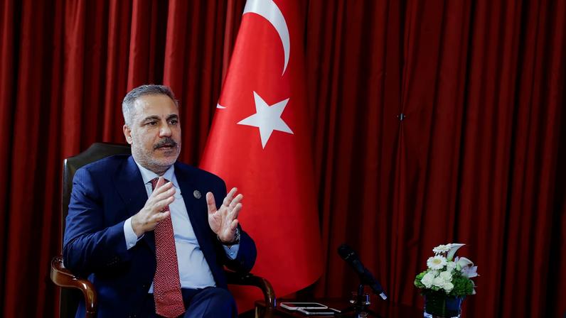 Turkish Foreign Minister Hakan Fidan speaks during an interview with Reuters at the 23rd edition of the annual Doha Forum, in Doha