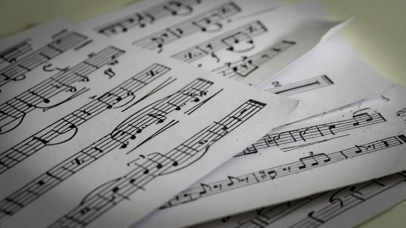 Close-Up Of Musical Notes On Sheet Music