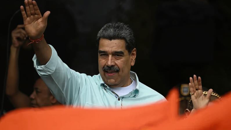 Venezuelan President Nicolas Maduro gestures during a rally in Caracas on December 10, 2025.