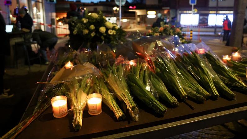Flowers and candles are left near the "Le Constellation" bar, after a fire and explosion during a New Year’s Eve party where several people died and others were injured, according to Swiss police, in the upscale ski resort of Crans-Montana in southwestern Switzerland, January 1, 2026. REUTERS/Denis Balibouse