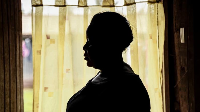 An HIV-positive mother, who used to receive financial support from the U.S. Agency for International Development, poses for a photo in Kisumu, Kenya, on April 24, 2025.