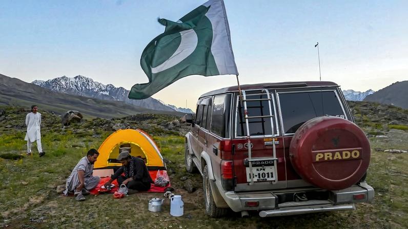 People camp during the Shandur Polo Festival in the Chitral district of Pakistan's Khyber Pakhtunkhwa province on June 20, 2025.