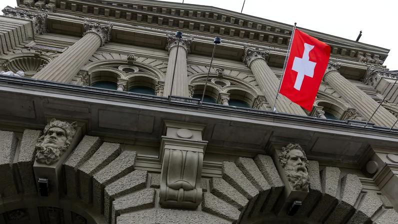 A Swiss flag hangs at the Swiss Parliament building (Bundeshaus) in Bern, Switzerland, March 12, 2025. REUTERS/Denis Balibouse
