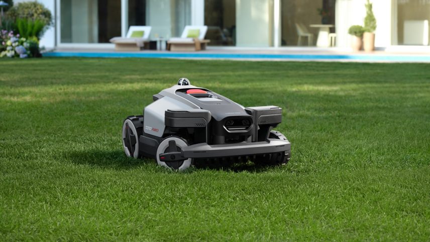The Roborock RockMow X1 LiDAR robot lawnmower in a yard