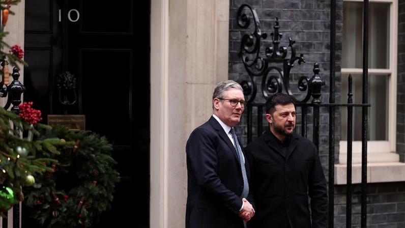 Britain's Prime Minister Keir Starmer greets Ukraine's President Volodymyr Zelenskiy outside 10 Downing Street, on the day of E3 partners France, Germany and Britain's meeting, in London, Britain December 8, 2025. ADRIAN DENNIS/Pool via REUTERS