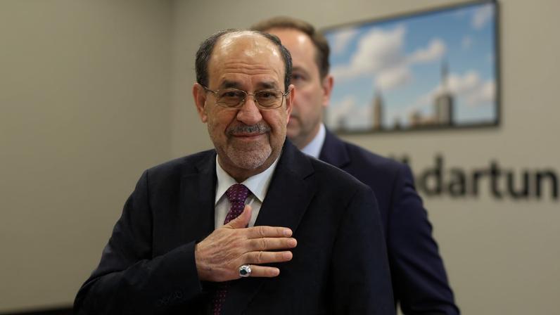 Former Iraqi Prime Minister Nouri al-Maliki reacts at a polling station inside Al-Rasheed Hotel during the parliamentary election in Baghdad, Iraq, November 11, 2025. REUTERS/Thaier Al-Sudani/File Photo