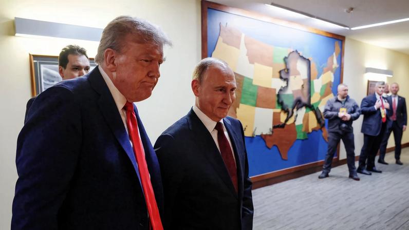U.S. President Donald Trump and Russian President Vladimir Putin walk to a joint news conference following their meeting at Joint Base Elmendorf-Richardson in Anchorage, Alaska, U.S., August 15, 2025.