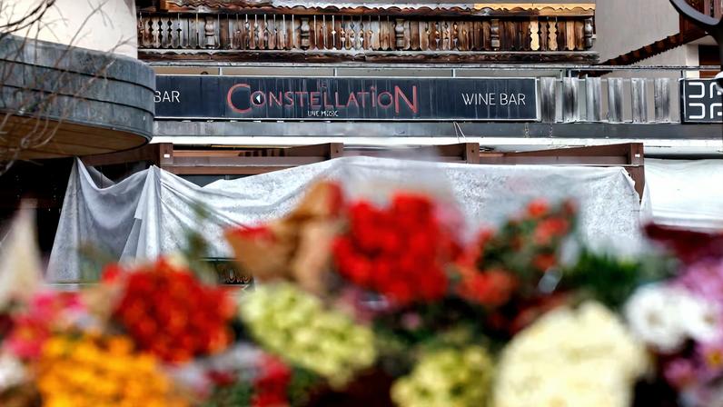 Tributes lie near the "Le Constellation" bar, after a deadly fire and explosion during a New Year's Eve party in the upscale ski resort of Crans-Montana in southwestern Switzerland, January 3, 2026. REUTERS/Lisa Leutner