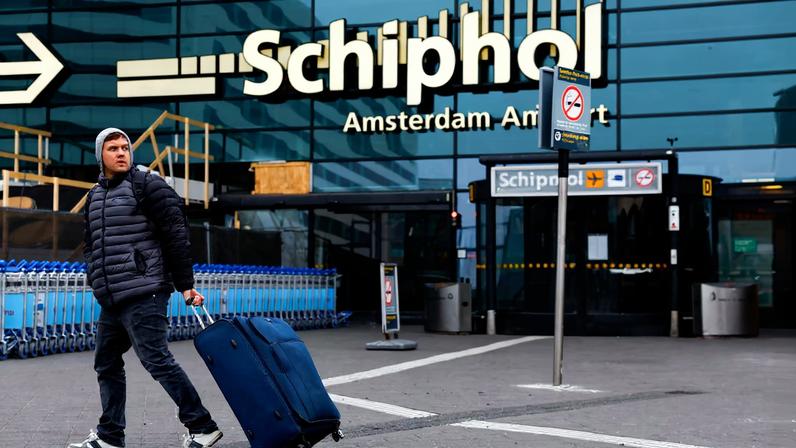 A person walks at Amsterdam Airport Schiphol in Amsterdam, Netherlands, November 8, 2024. REUTERS/Piroschka Van De Wouw