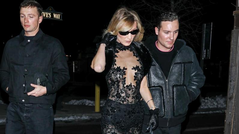 Bella Hadid stepping out in below-freezing Aspen wearing a completely sheer vintage Georges Chakra dress — and little else.