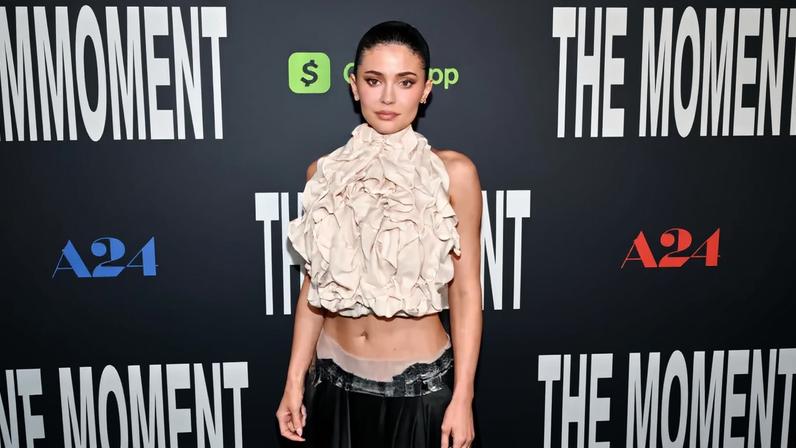Kylie Jenner wore an ab-baring Maison Martin Margiela Spring 2026 look to the Los Angeles premiere of “The Moment” Thursday.