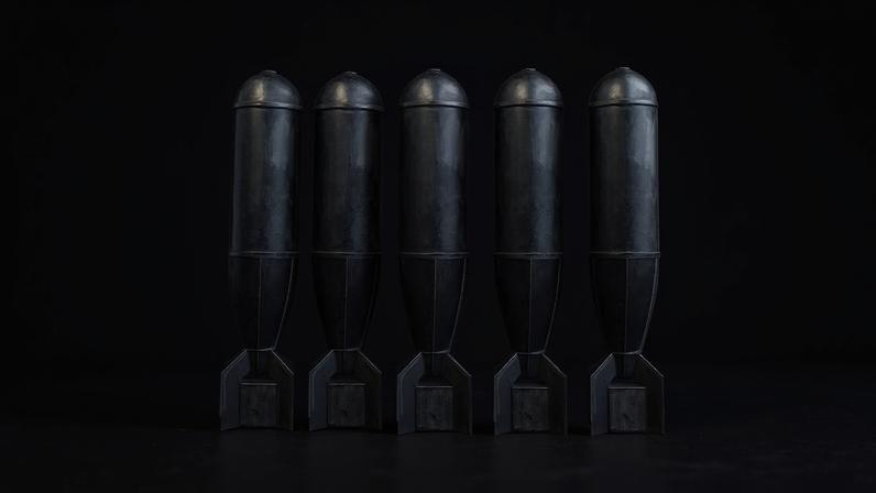 An illustration shows a row of nuclear missiles with the first one starting to fall like dominoes.