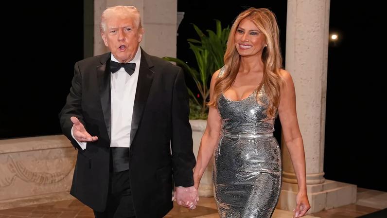 Melania Trump wore a sparkling silver dress by The New Arrivals to co-host a New Year’s Eve party at Mar-a-Lago with her husband, Donald.