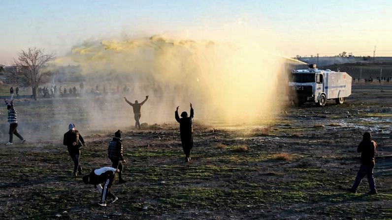 Turkish security forces disperse protesters near the Nusaybin border gate in Mardin on the Turkey-Syria border on January 20.