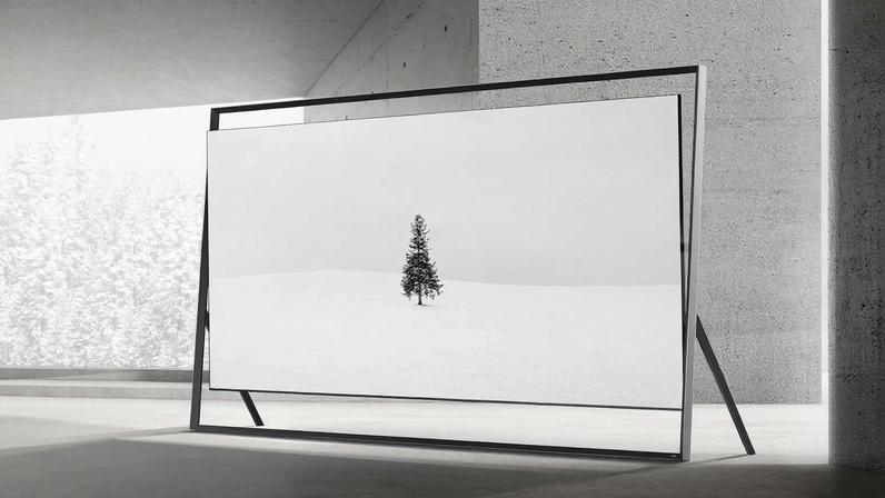 The 130-inch Samsung Micro RGB TV with the Timeless Frame in a stone room.