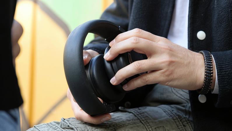 The TDM Neo headphones shown in both headphone and speaker modes.