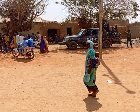 Military personnel stand guard after a deadly raid in Doma, Katsina State, Nigeria, on 4 February. Insecurity is a pressing concern in Nigeria and the government is under mounting pressure to restore stability.