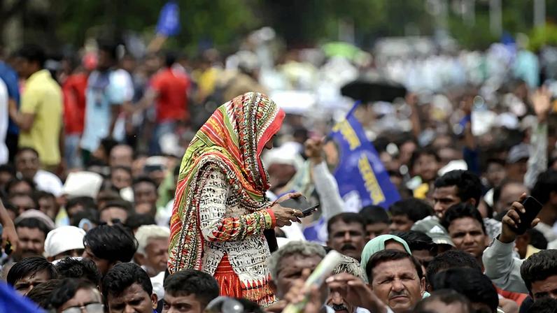 An Indian woman and supporter of the Dalit caste community walks through a protest rally against an earlier attack on Dalit caste members in the Gujarat town of Una, in Ahmedabad, India, on July 31, 2016.