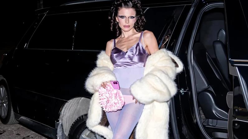 Julia Fox arrived at Marc Jacobs’ Spring 2026 runway show at the Park Avenue Armory on Monday wearing a purple satin bra and pale pink underwear as outerwear.
