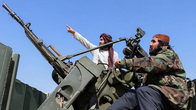 Taliban security personnel operating an anti-aircraft gun keep watch for Pakistani airstrikes near the Durand Line in Gurbuz district of Khost province.