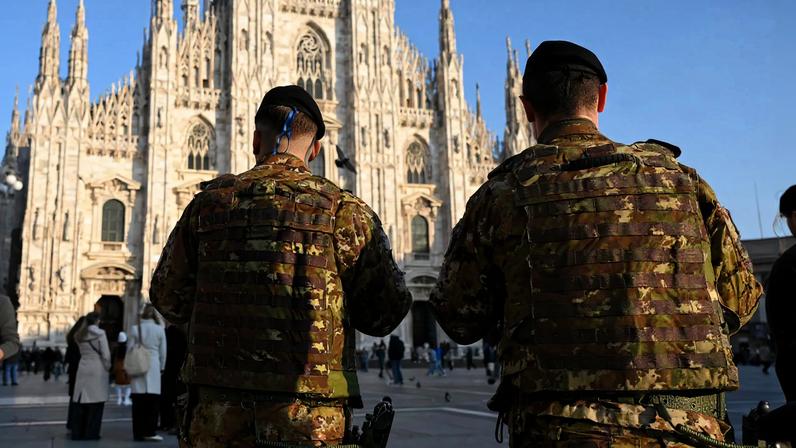 Italian military personnel in front of the Piazza del Duomo in Milan, Italy.