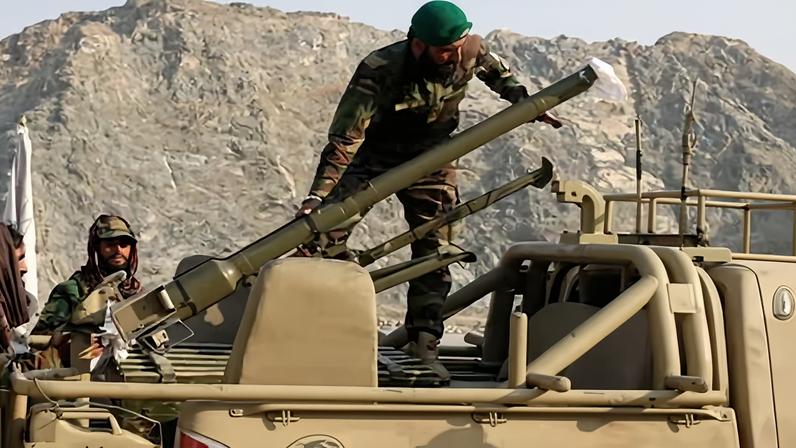 Taliban soldiers load a rocket launcher in a vehicle near the Torkham border crossing in Afghanistan.