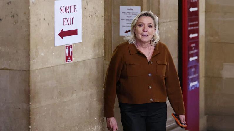 French far-right leader Marine Le Pen, member of parliament for the Rassemblement National (National Rally - RN) party, is seen during a break in a hearing during which prosecutors present their sentencing request in her appeal trial, alongside the RN party itself and 10 others defendants found guilty of diverting European Parliament funds, at the Paris courthouse on the Ile de la Cite, in Paris, France, February 3, 2026. REUTERS/Abdul Saboor